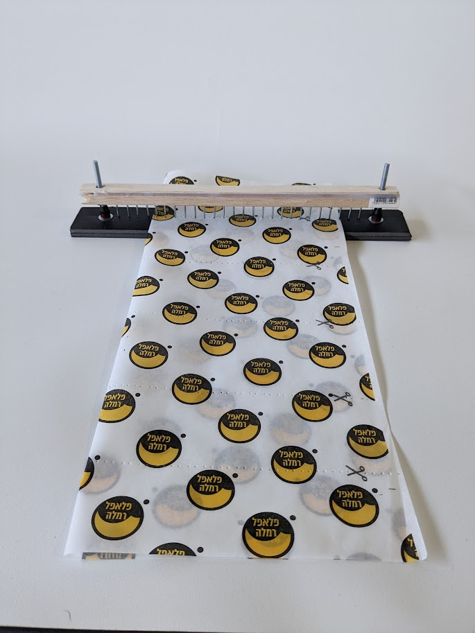 Custom-built device used to perforate the wrapping paper